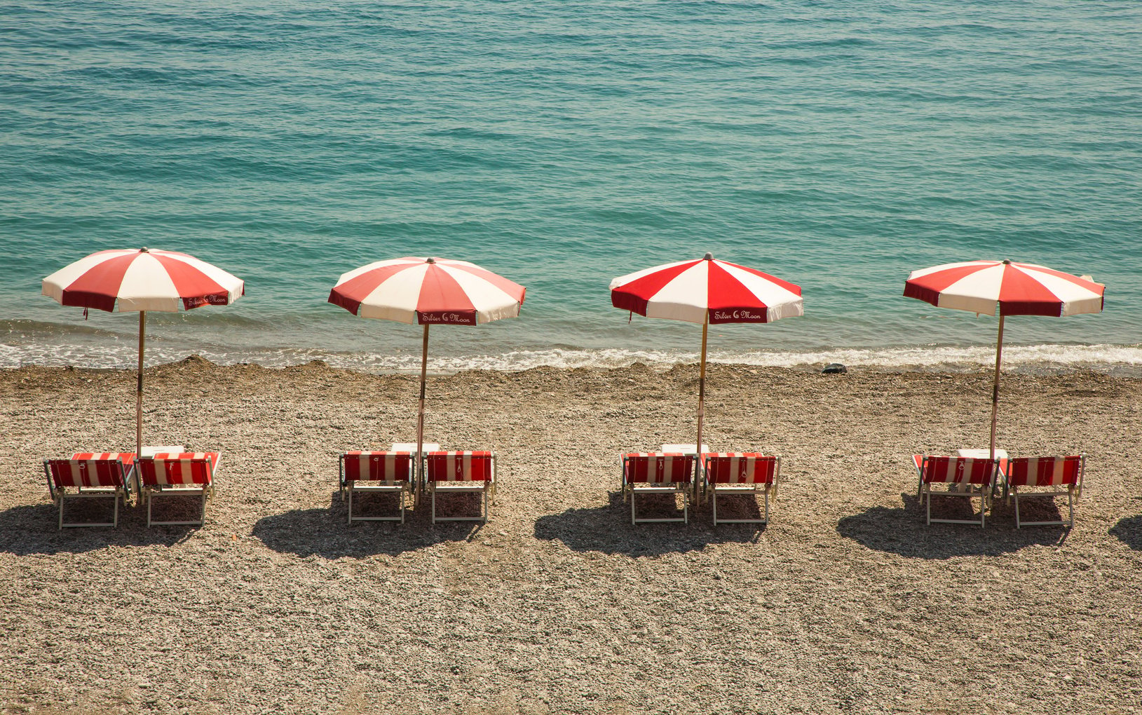 Sun Loungers on Sandy Beach